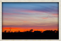 Farm silhouette at sunset