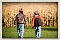 Hunters preparing to walk the field in search of some wild roosters